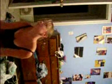 Blonde young girl taking her clothes off slowly
