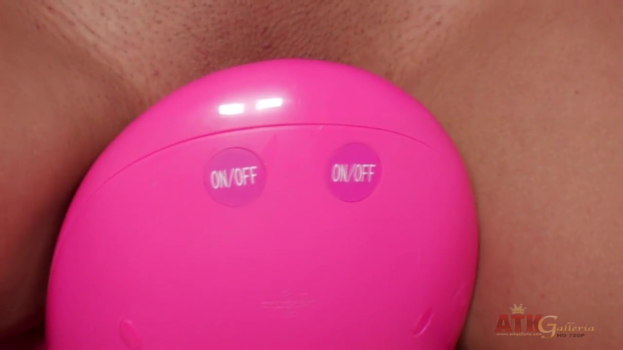 Exotic brunette riding a toy