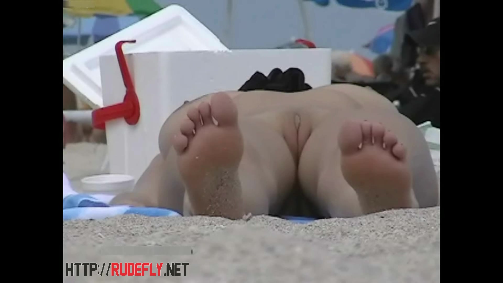 Blonde cutie undressing nudist beach video