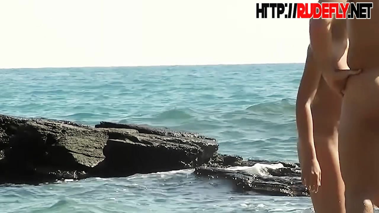 Porno of thin nude chicks on a nudist beach relaxing and talking
