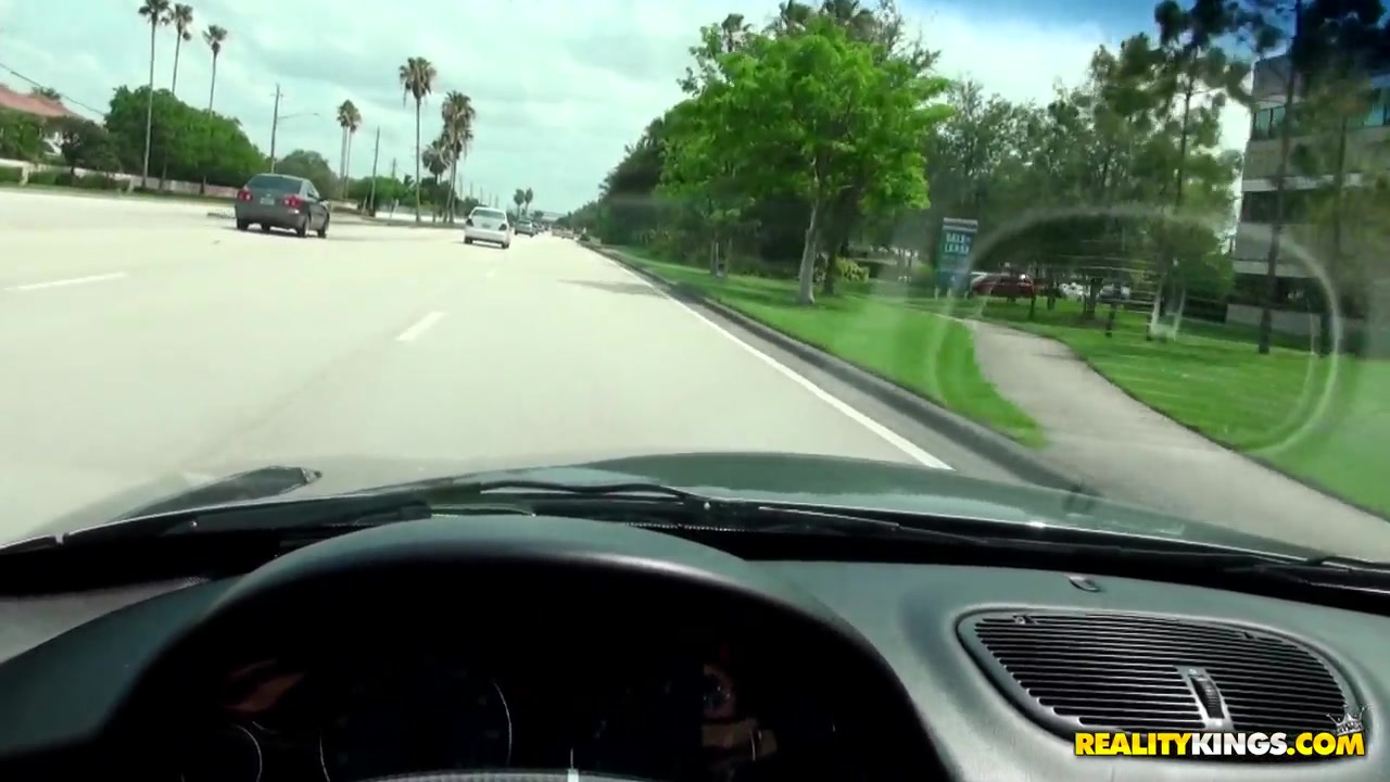 Caprice sucks on a dong while driving
