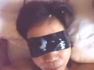 Blindfolded Japanese girlfriend receiving a cumshot on her face