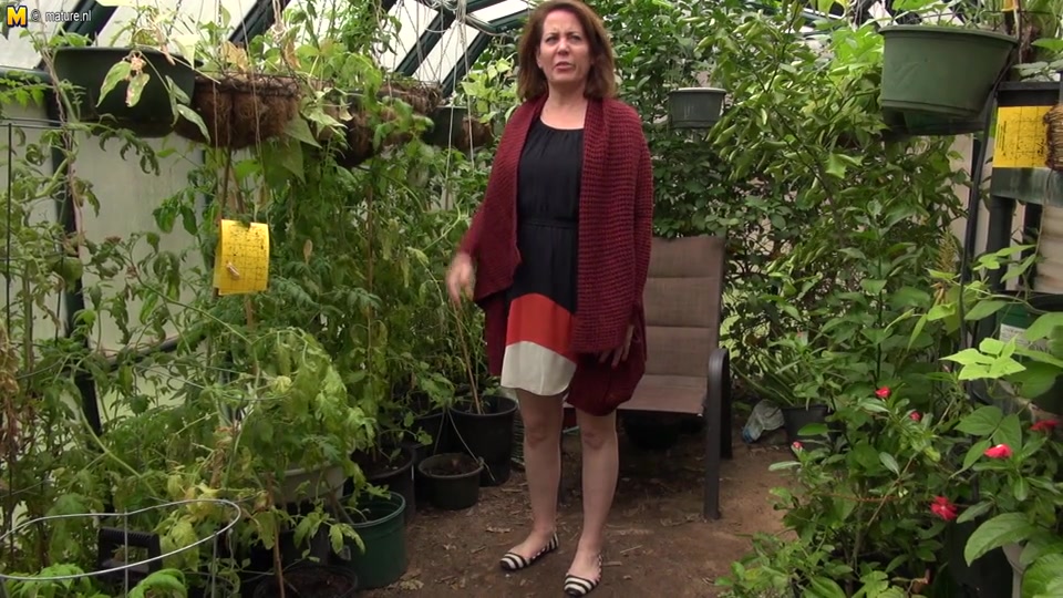 This American Cougar Gets Frisky In Her Gardenhouse - MatureNL