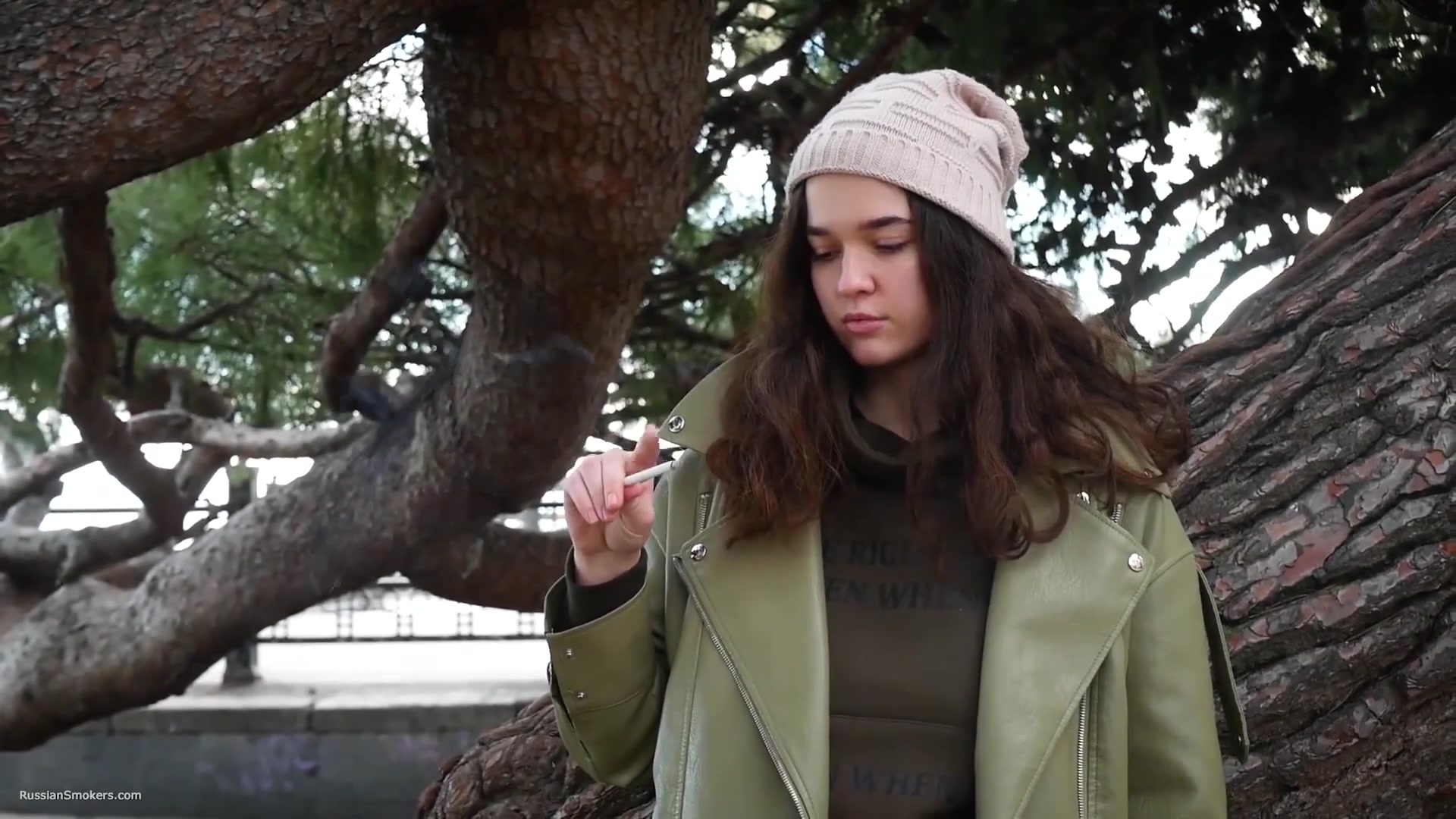 Young Brunette Is Taking An Unhurried Stroll With Allwhite 120mm Cigarette