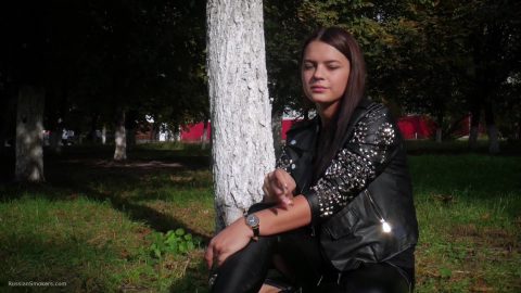 Pretty Faced Asya Is Smoking A Cigarette Outdoors