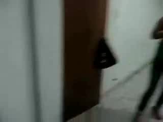 Asian cutie leans toward stiff cock and blows it