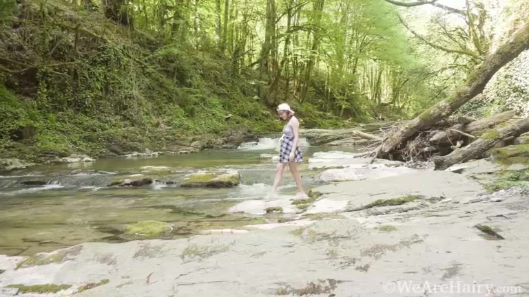 Abby strips naked by her favorite stream