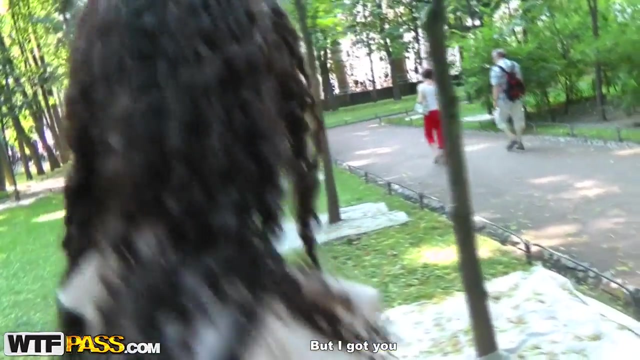 Cute curly brunette Leonora shows her boobs in park