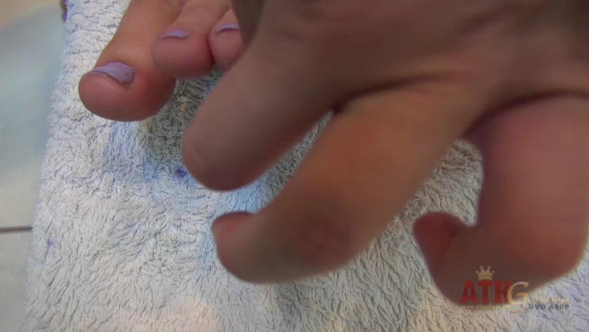 ATKGirlfriends video: Ashley Stone stripping to her bikini and laying in the California sun.