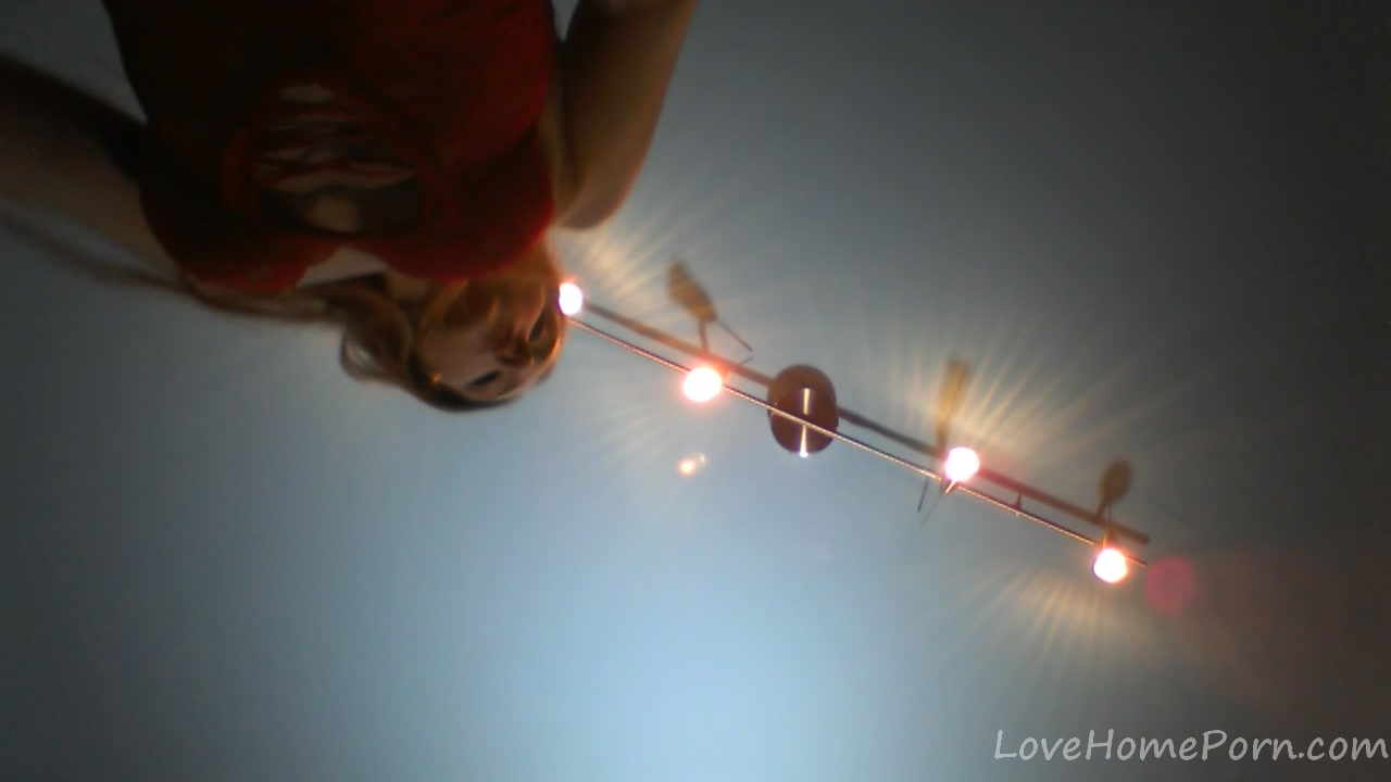 Redhead in a red dress rubs her pussy