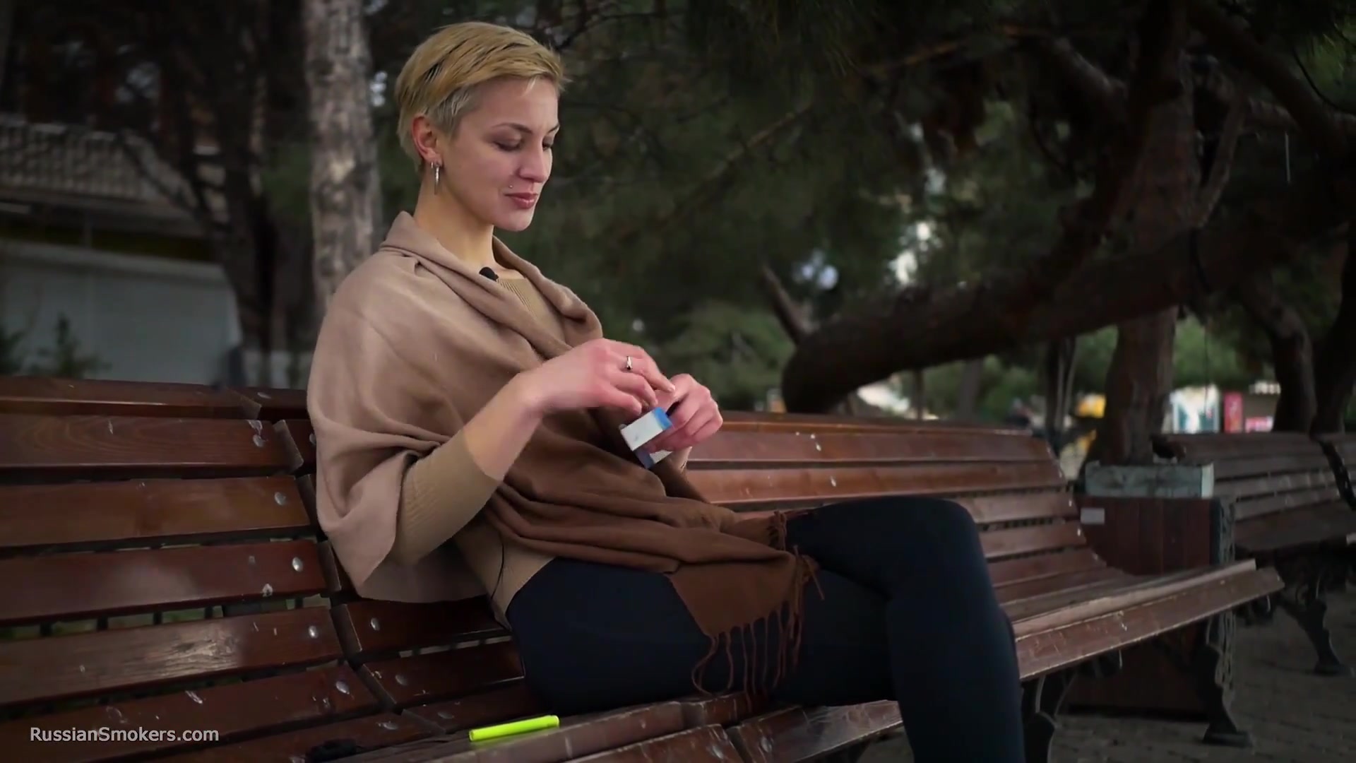 Short Cut Hair Blonde Girl Is Smoking All White 120mm Cigarettes