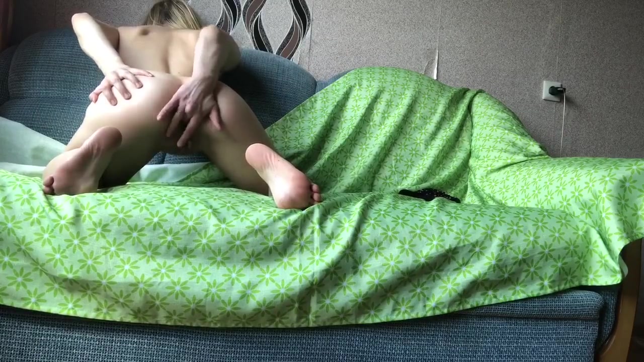 Blonde Caresses Her Small Tits And Jerks Off Doggy Style On The Bed