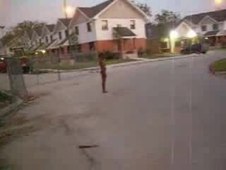 Curly black slut walks naked around the neighborhood