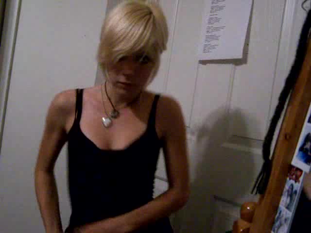 Short-haired blonde girl dances in the homemade video