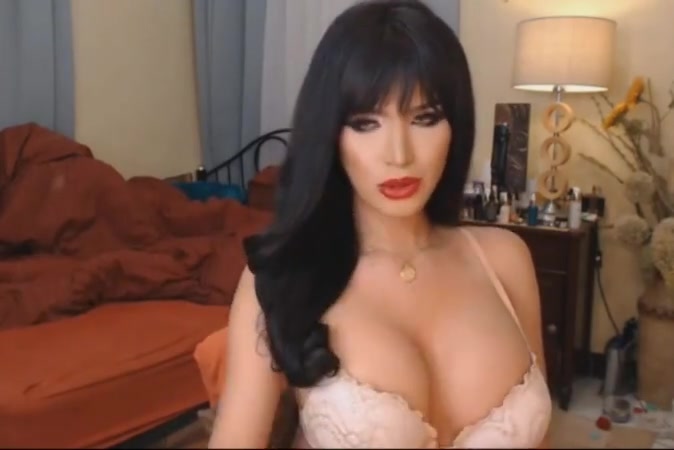 Beautiful big tits tranny wanks her hard cock