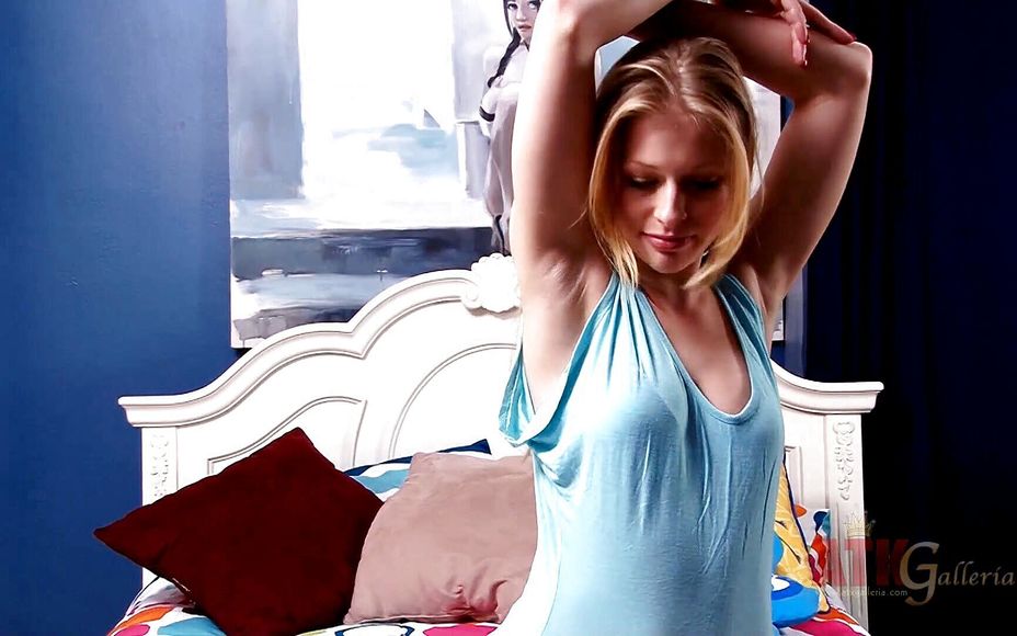 Alluring teen pleasing herself with vibrator