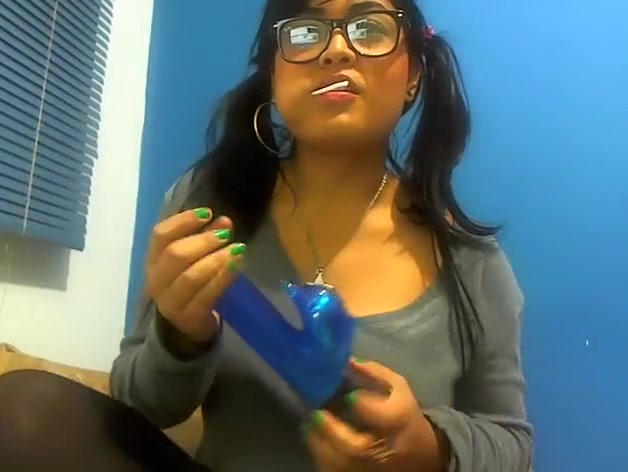 Pig-tailed adorable gal sucking a lollipop and showing her cleavage