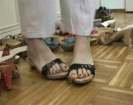Lovely woman trys on different shoes in the foot fetish vid