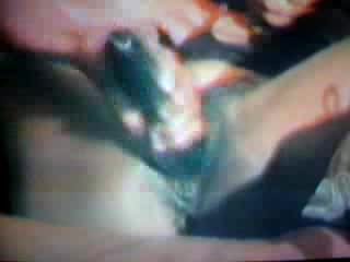 Ebony lady spreads her pussy lips to shove a huge dildo