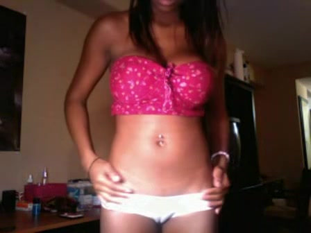 Chocolate-skinned boomshell in pink bra demonstrating her details