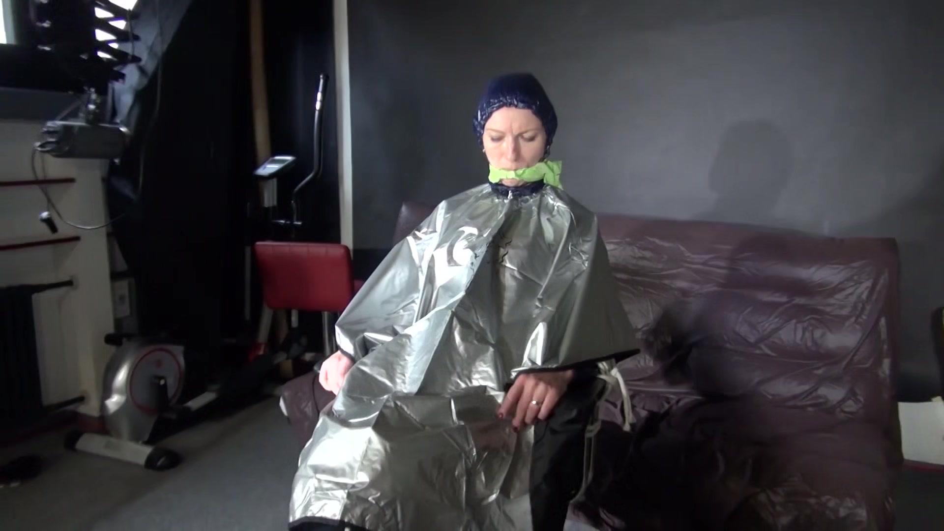 Sexy Ronja Being Tied, Gagged And Hooded On A Chair With A Clothgag Wearing Sexy Blue Shiny Nylon Rainwear (Video)