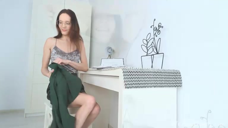 Mia Sanders masturbates by her white desk