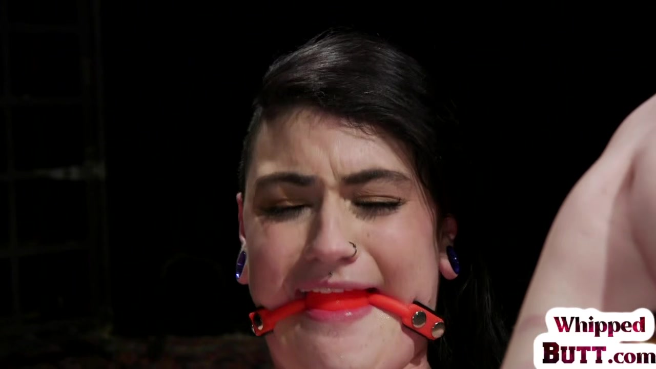 Curvy lezdom whipping and caning her gagged submissive
