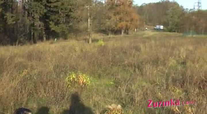 Zuzinka in a field teased by horny camera guy