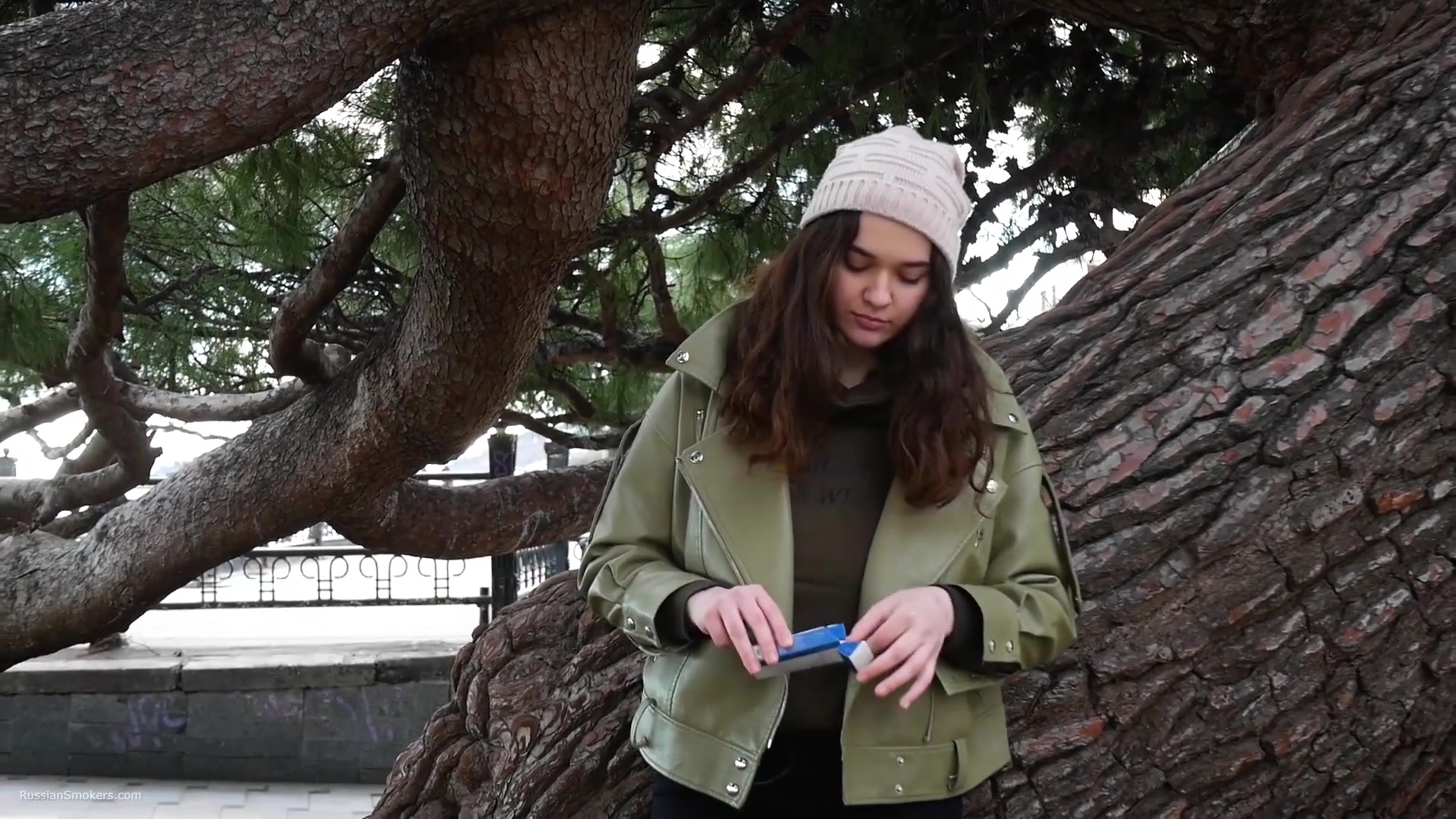 Young Brunette Is Taking An Unhurried Stroll With Allwhite 120mm Cigarette
