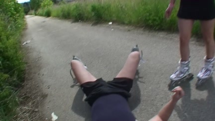 Gal on roller skates engulf on the bike path