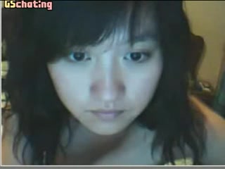 Kinky Oriental girl sliding fingers inside her vagina