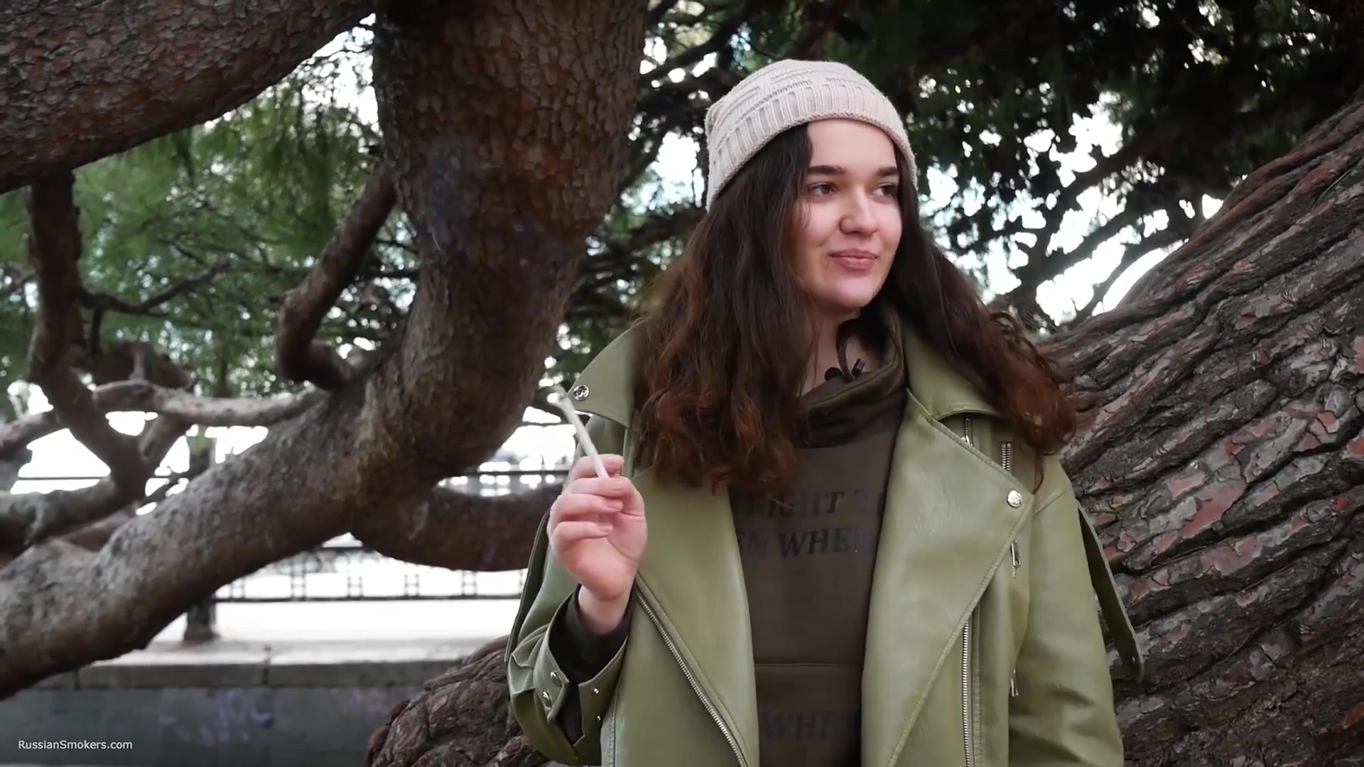 Young Brunette Is Taking An Unhurried Stroll With Allwhite 120mm Cigarette