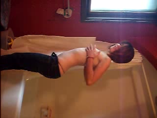 Skinny emo chick strips and touches her nice pussy