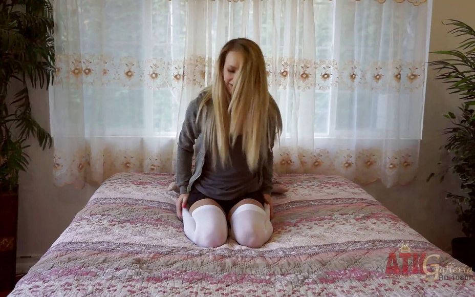 Lovely teen in sexy stockings touches her pussy