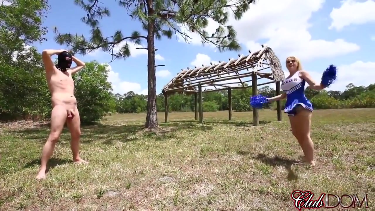 A Cheerleaders Kicking Bag