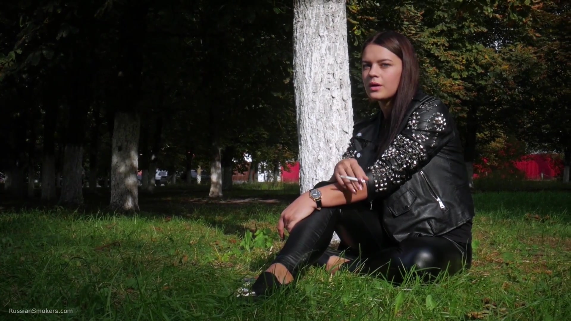 Pretty Faced Asya Is Smoking A Cigarette Outdoors
