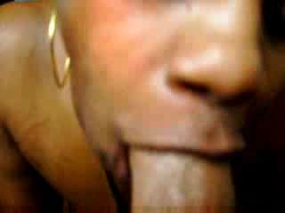 Short-haired chocolate woman tastes rod with passion