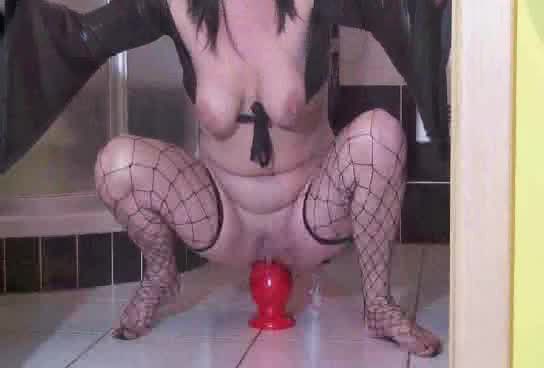 Stuffing a huge posterior with a toy and a fist