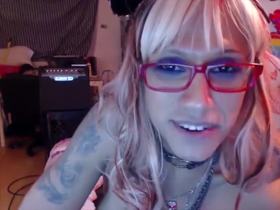 Tattoed blonde shemale gets horny