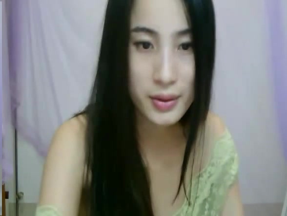 Amazing Asian girl stripteasing in front of the webcam