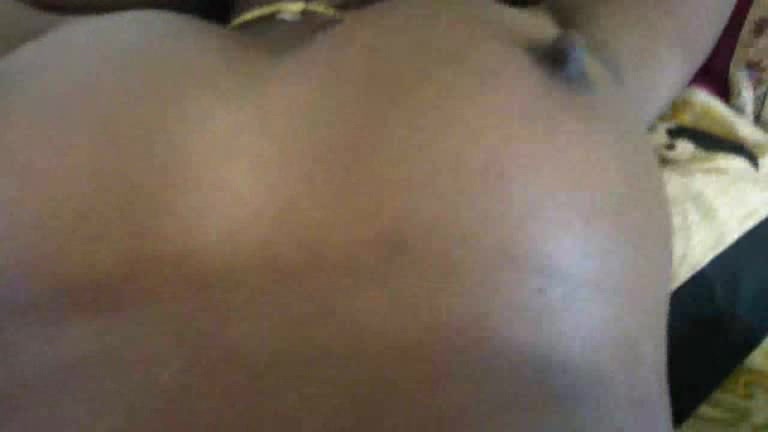 Black skinned girl has something inside her pussy