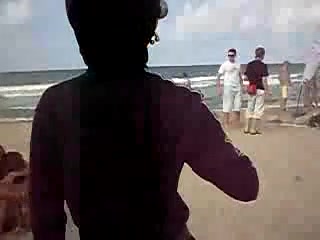 Naughty couple caught fucking on a public beach