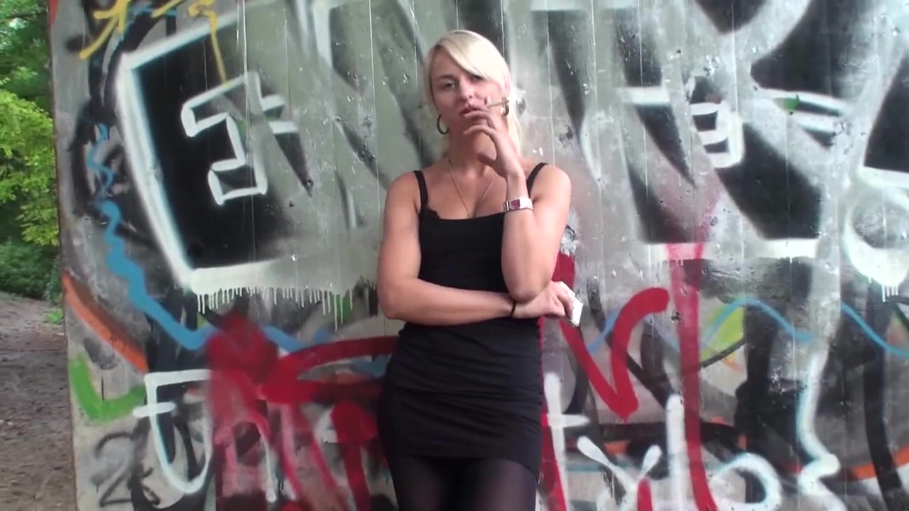 Lovely blonde teen 18+ smoking a cigarette outdoors by Femdom Austria