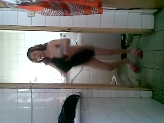 Dark-haired woman shower her dirty pussy on video
