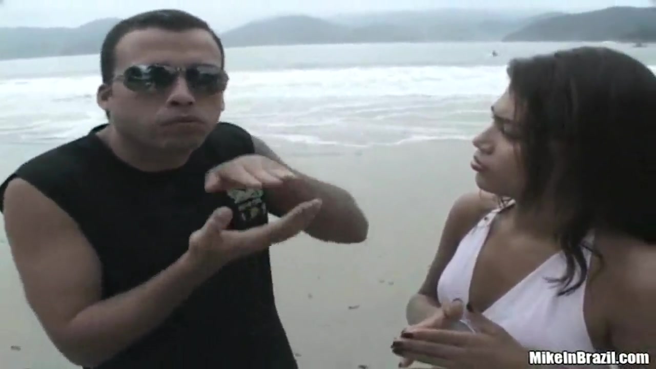 Tanned Latin girl having fun with pal outside