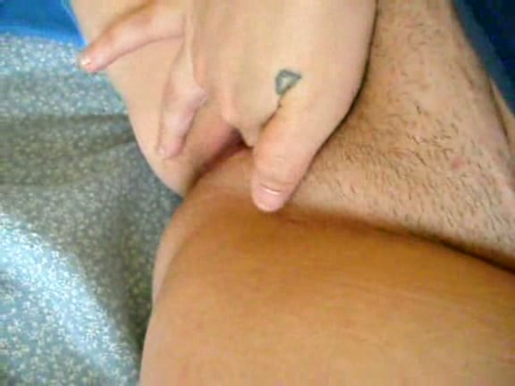 Latina masturbates on bed