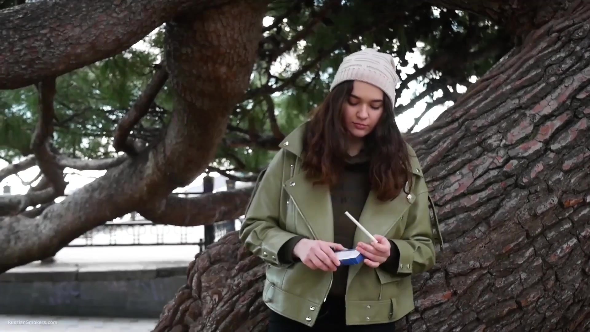 Young Brunette Is Taking An Unhurried Stroll With Allwhite 120mm Cigarette