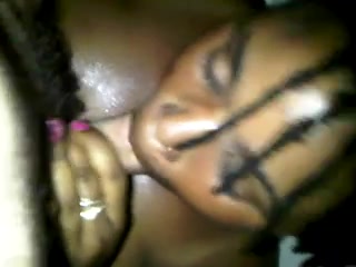 Darksome slut giving head while embracing my dick with her tits