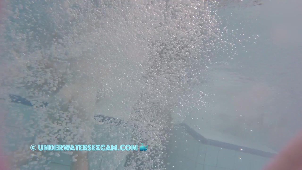 This Young Couple Plays Together Underwater In Front Of Many People