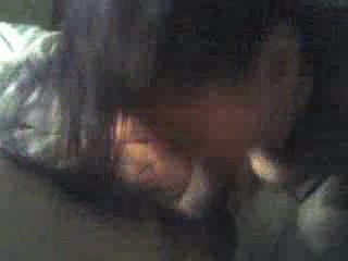 Long-haired brunette sucking on cock like it's her last time